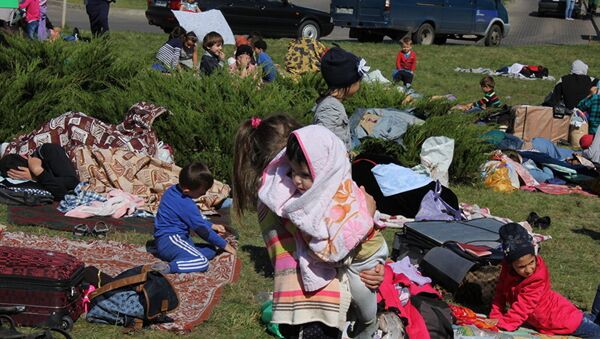 Беженцы из Чечни разбили лагерь на белорусок-польской границе - Sputnik Lietuva