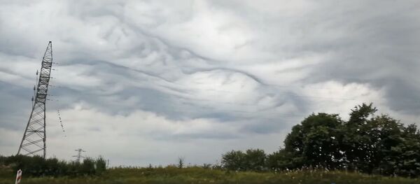 Впечатляющие облака в Каунасе Впечатляющие облака в Каунасе - Sputnik Литва